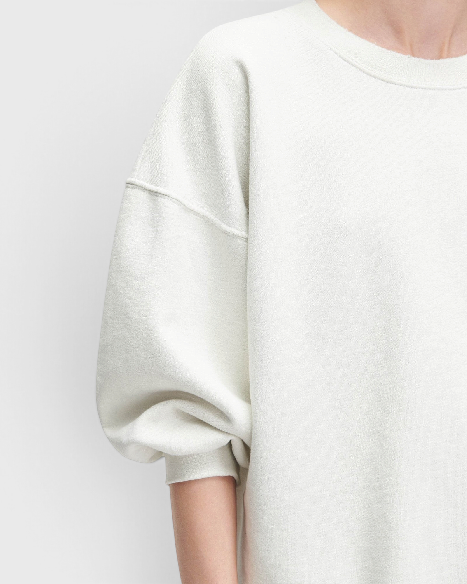 JONES + CO Rachel Comey Fond crewneck sweatshirt in dirty white with drop shoulders and raw edge hemline