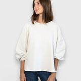 JONES + CO Rachel Comey Fond crewneck sweatshirt in dirty white with drop shoulders and raw edge hem on a model
