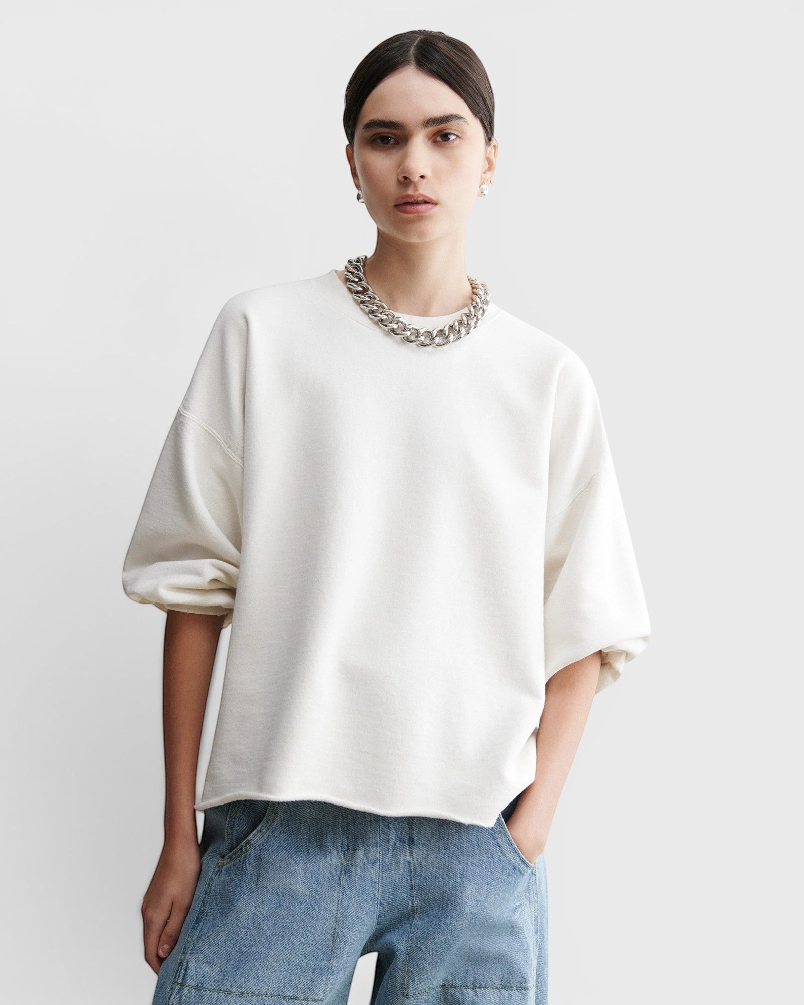 JONES + CO Rachel Comey Fond crewneck sweatshirt in dirty white with drop shoulders and raw edge hem on a model