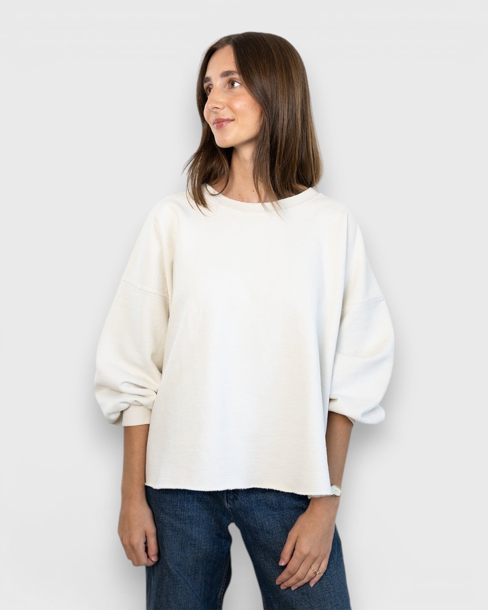 JONES + CO Rachel Comey Fond crewneck sweatshirt in dirty white with drop shoulders and raw edge hem on a model