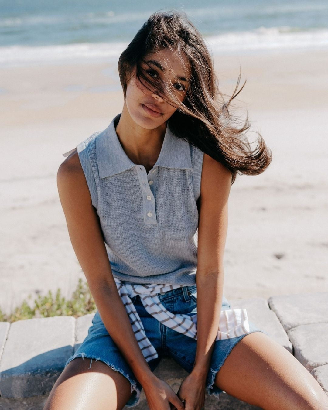 JONES + CO Fran Polo Tank in heather grey pointelle knit. Sleeveless, collared, button-up front. Model wears with denim shorts.