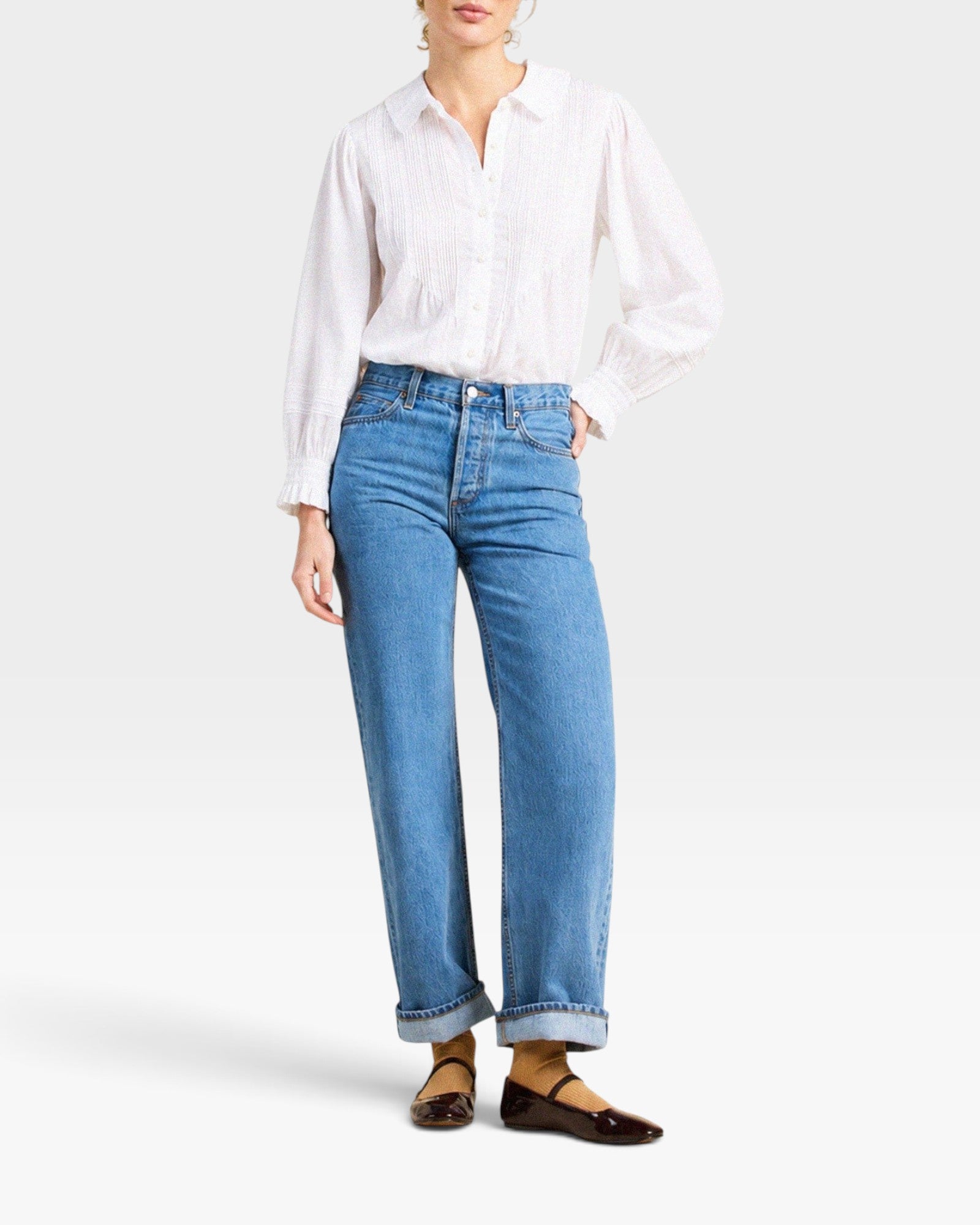 JONES + CO Francesca white voile blouse with oversized collar, pintucked placket, and ruffled cuffs on a model