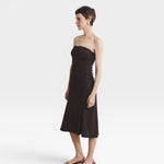 JONES + CO Gaia strapless midi dress in espresso. A-line skirt, ruched bodice, and a flattering silhouette.
