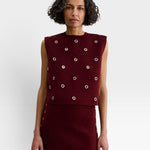 JONES + CO garnet baby alpaca knit vest with metallic eyelet details and a boxy, structured silhouette.
