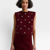 JONES + CO garnet baby alpaca knit vest with metallic eyelet details and a boxy, structured silhouette.