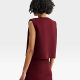 JONES + CO garnet baby alpaca Vega vest with structured boxy silhouette and metallic eyelet details on side