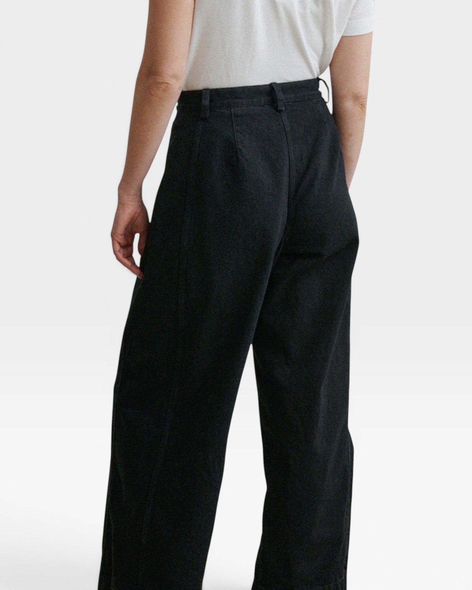 JONES + CO Garra high-waisted black denim jeans with a relaxed wide-leg fit and contrast side panels, back view.