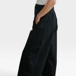 JONES + CO Garra high-waisted black denim jeans with a relaxed wide leg and contrast side panel detail