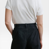 Back view of JONES + CO Garra Pant in black denim with a high-waisted, relaxed fit and contrast side panels.