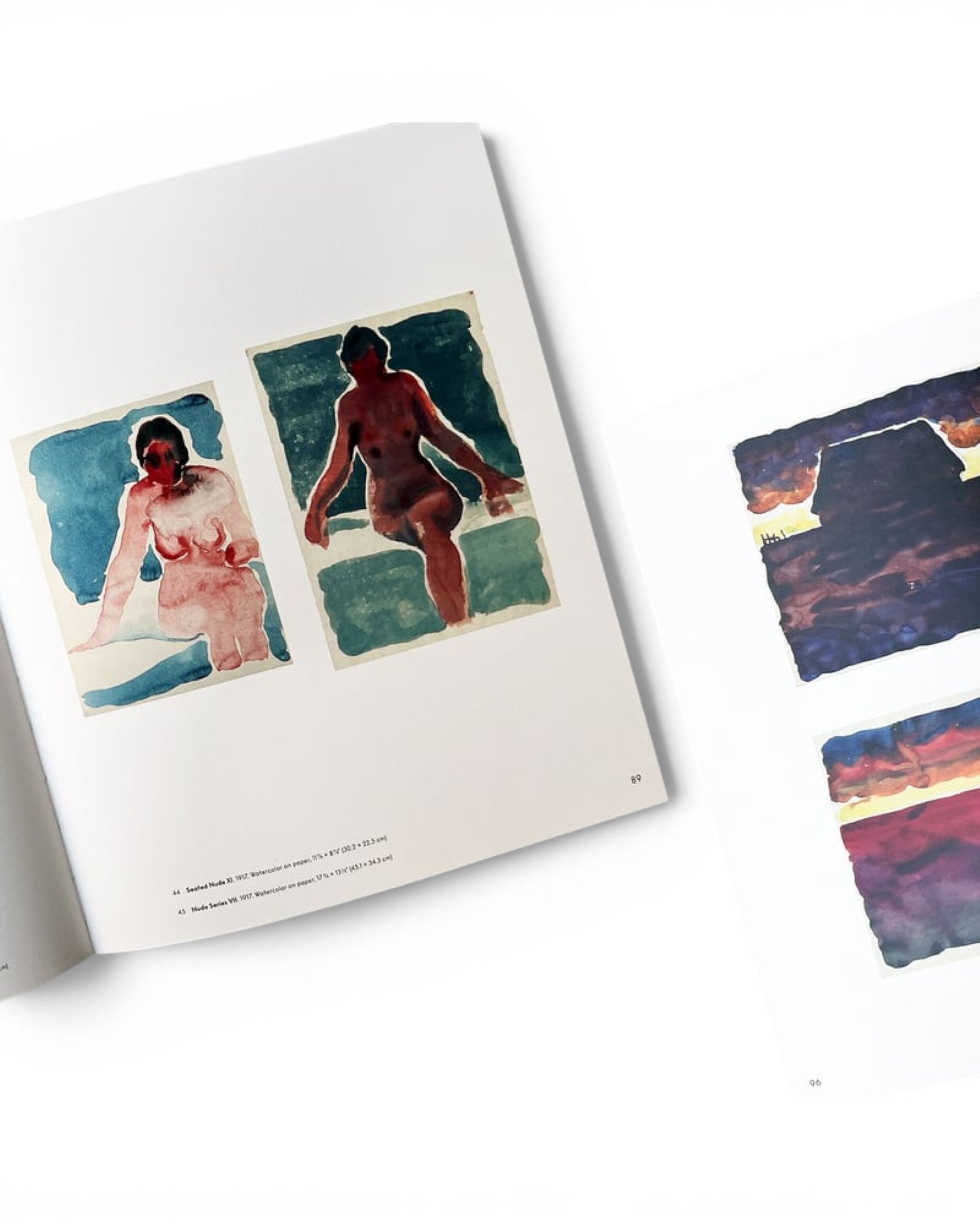 JONES + CO Georgia O’Keeffe book pages showing watercolor nude studies and abstract landscape paintings on paper.