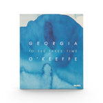 JONES + CO Georgia O’Keeffe: To See Takes Time art book featuring a blue watercolor abstract cover design.
