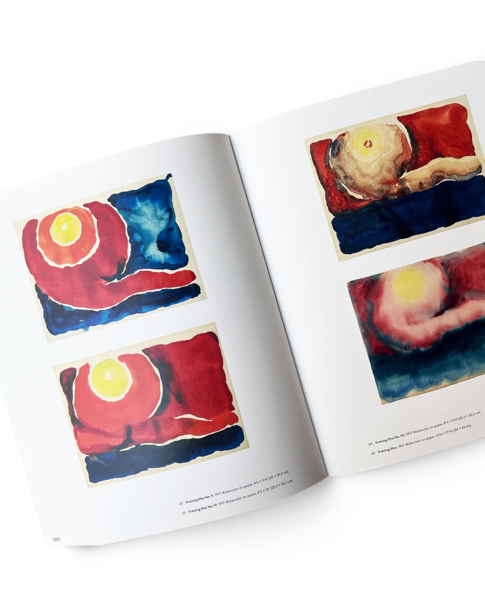 JONES + CO Georgia O’Keeffe To See Takes Time art book open to pages featuring colorful watercolor Evening Star series