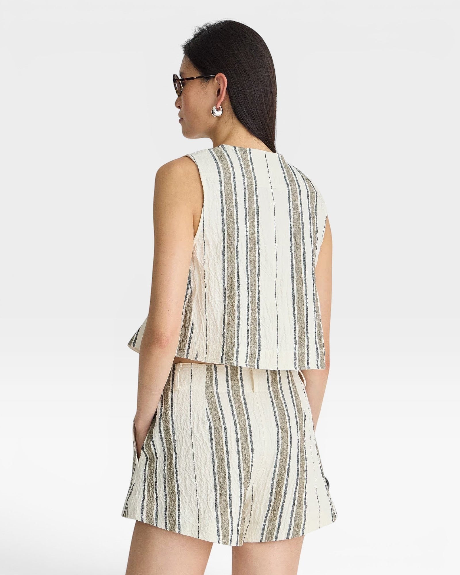 JONES + CO Godet Stripe Tank in cream with vertical stripes and textured fabric. Sleeveless, cropped style.