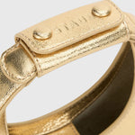 JONES + CO Good Night Moon evening bag in polished gold leather with a crescent silhouette and detachable strap