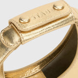 JONES + CO Good Night Moon evening bag in polished gold leather with a crescent silhouette and detachable strap