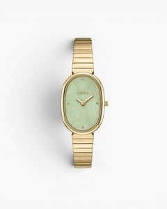JONES + CO Jane watch featuring a gold-plated oval case, mint green dial, and matching gold stainless steel bracelet.