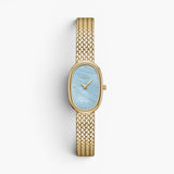 JONES + CO Jane Small watch with a gold woven mesh bracelet and an oval sky blue mother of pearl dial.
