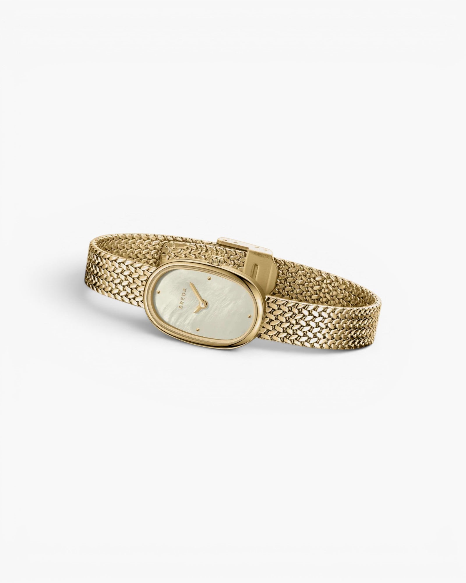 JONES + CO Jane Small watch with a gold oval case, champagne mother of pearl dial, and woven mesh bracelet.
