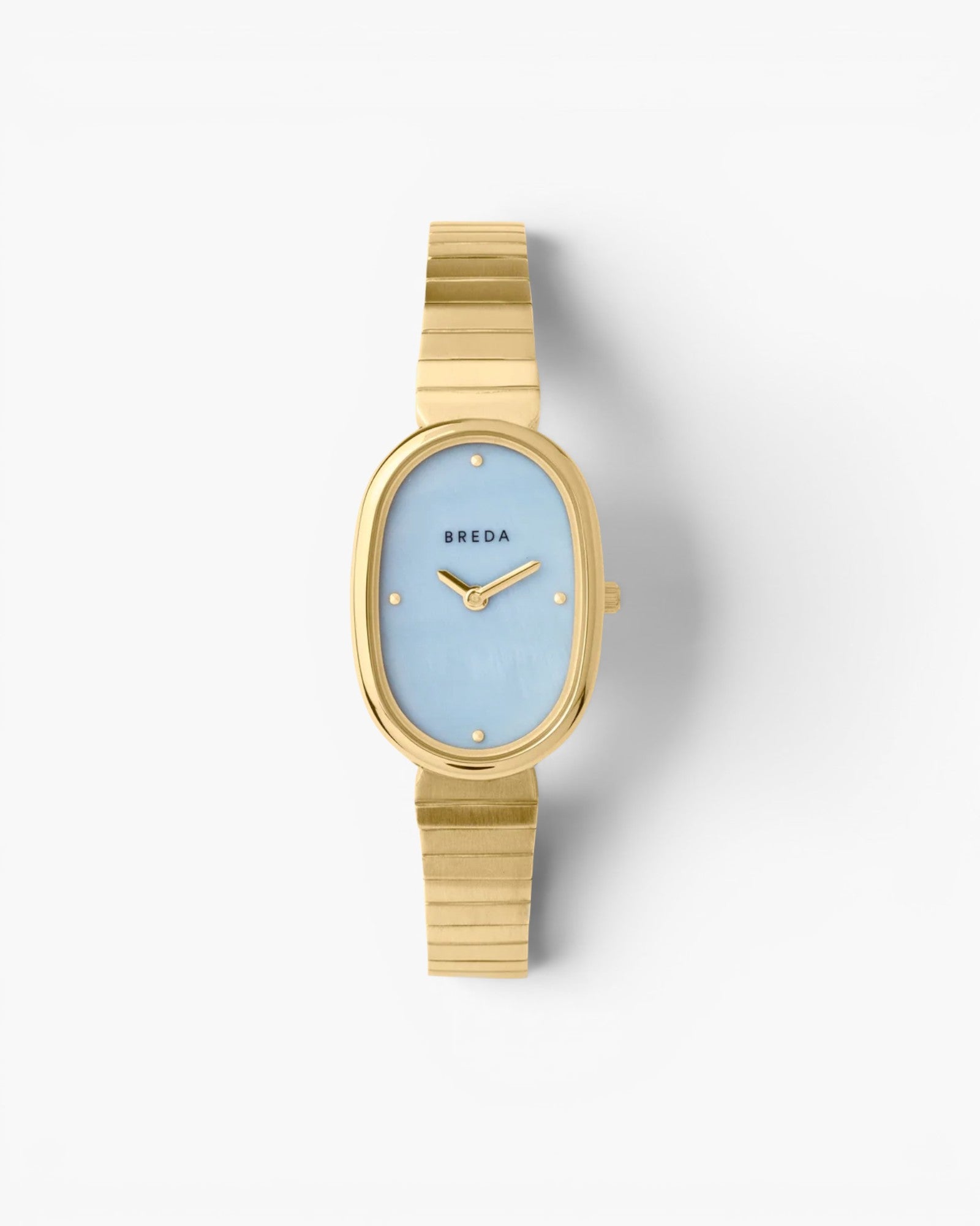 JONES + CO Jane watch with a 23mm gold oval case, sky blue mother-of-pearl dial, and gold-plated link bracelet.