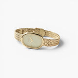 JONES + CO Jane Tethered watch featuring a gold oval case, champagne mother-of-pearl dial, and woven mesh bracelet.