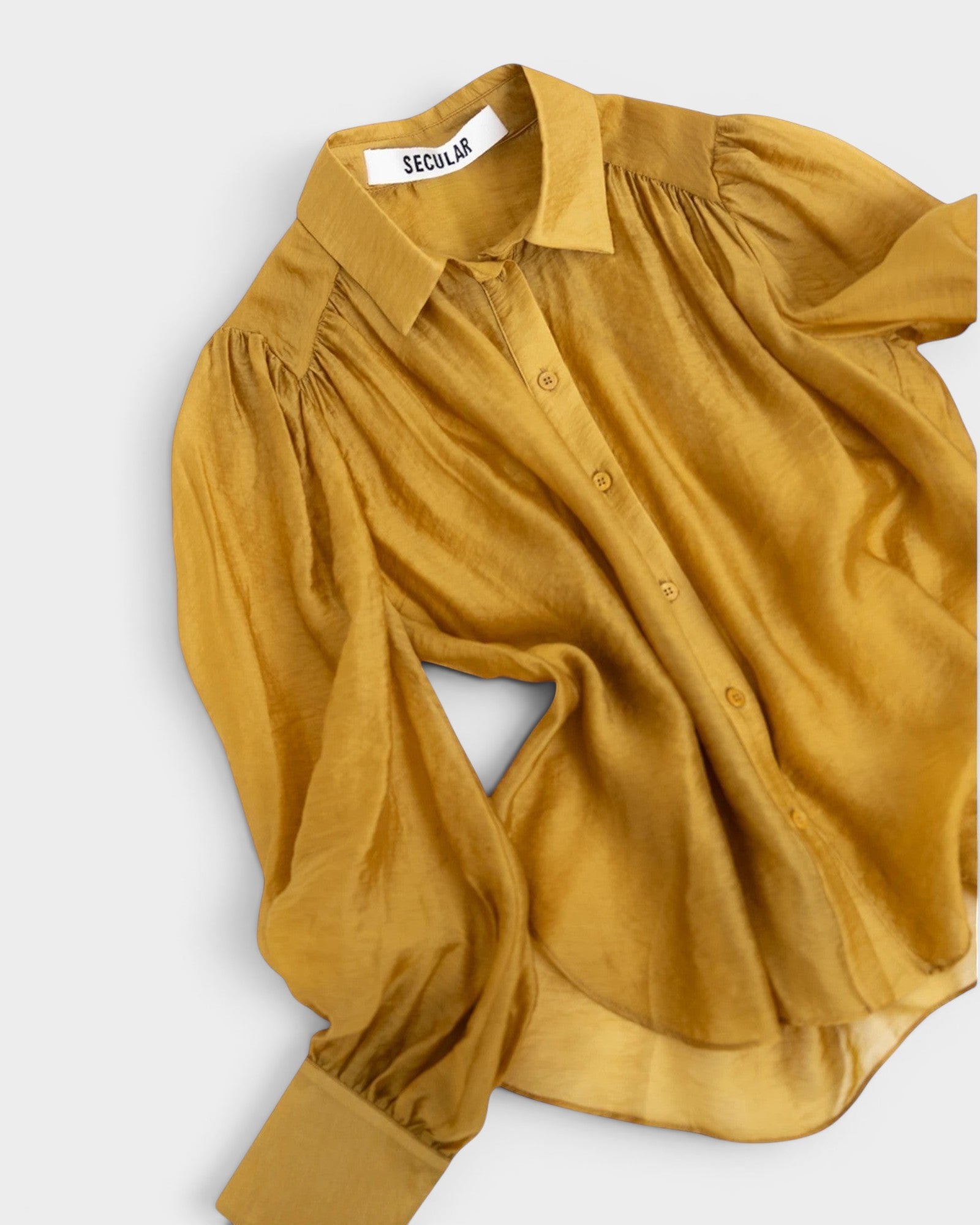 JONES + CO gold crinkled sheer button-up shirt with voluminous sleeves and pointed collar.