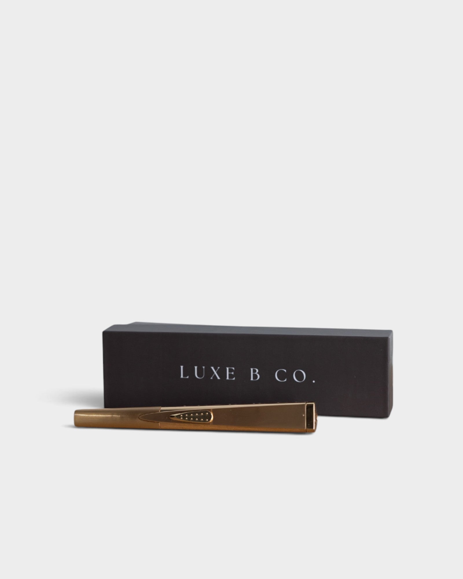 JONES + CO gold rechargeable USB arc lighter with its elegant black presentation box for luxury gifting.