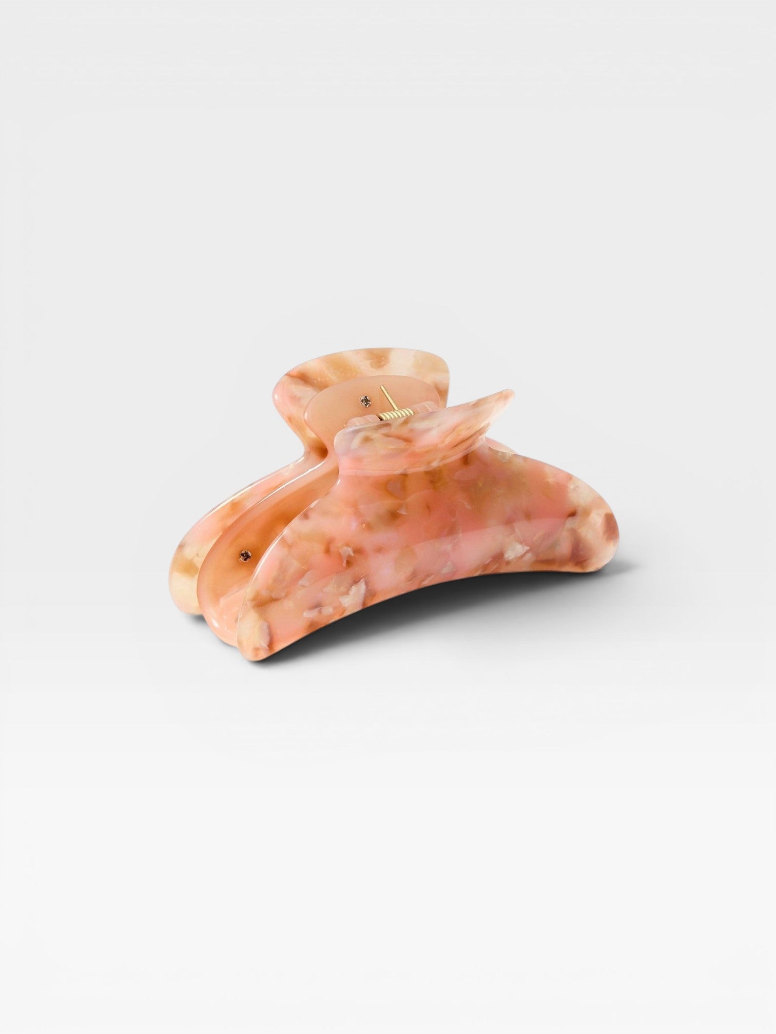 JONES + CO Grande Heirloom Claw in Blossom, a large hair claw clip made from Italian acetate in a marbled pink and cream pattern.