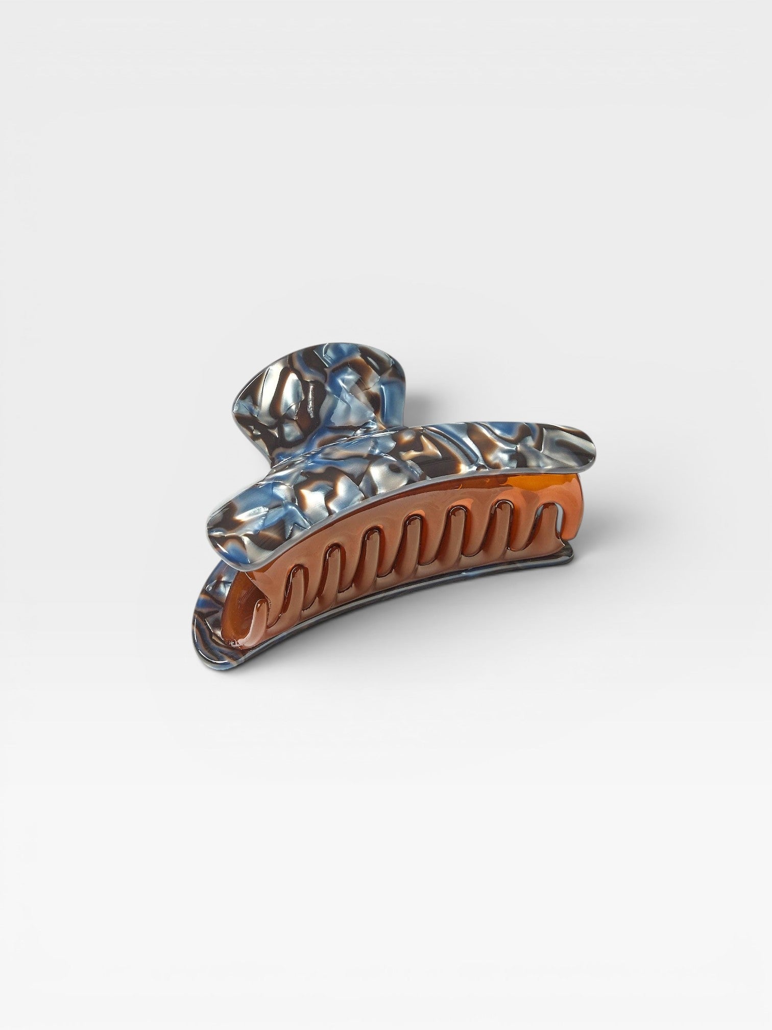 JONES + CO Grande Heirloom Claw in Blue Horn, a large hair claw clip made from Italian acetate with a marbled blue and brown tortoiseshell pattern.
