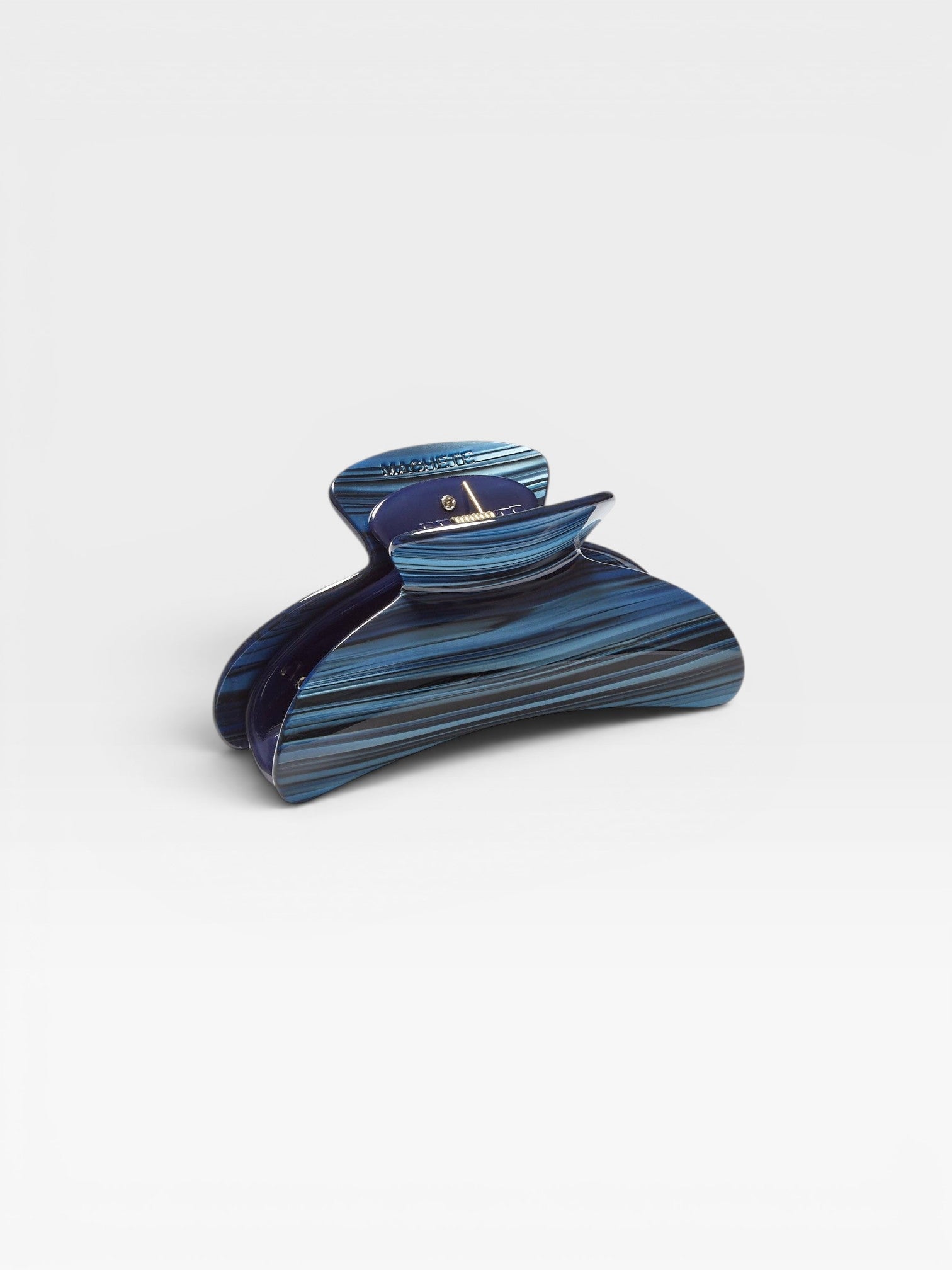 JONES + CO Grande Heirloom Claw Clip in blue and black striped acetate, ideal for thick hair and updos.
