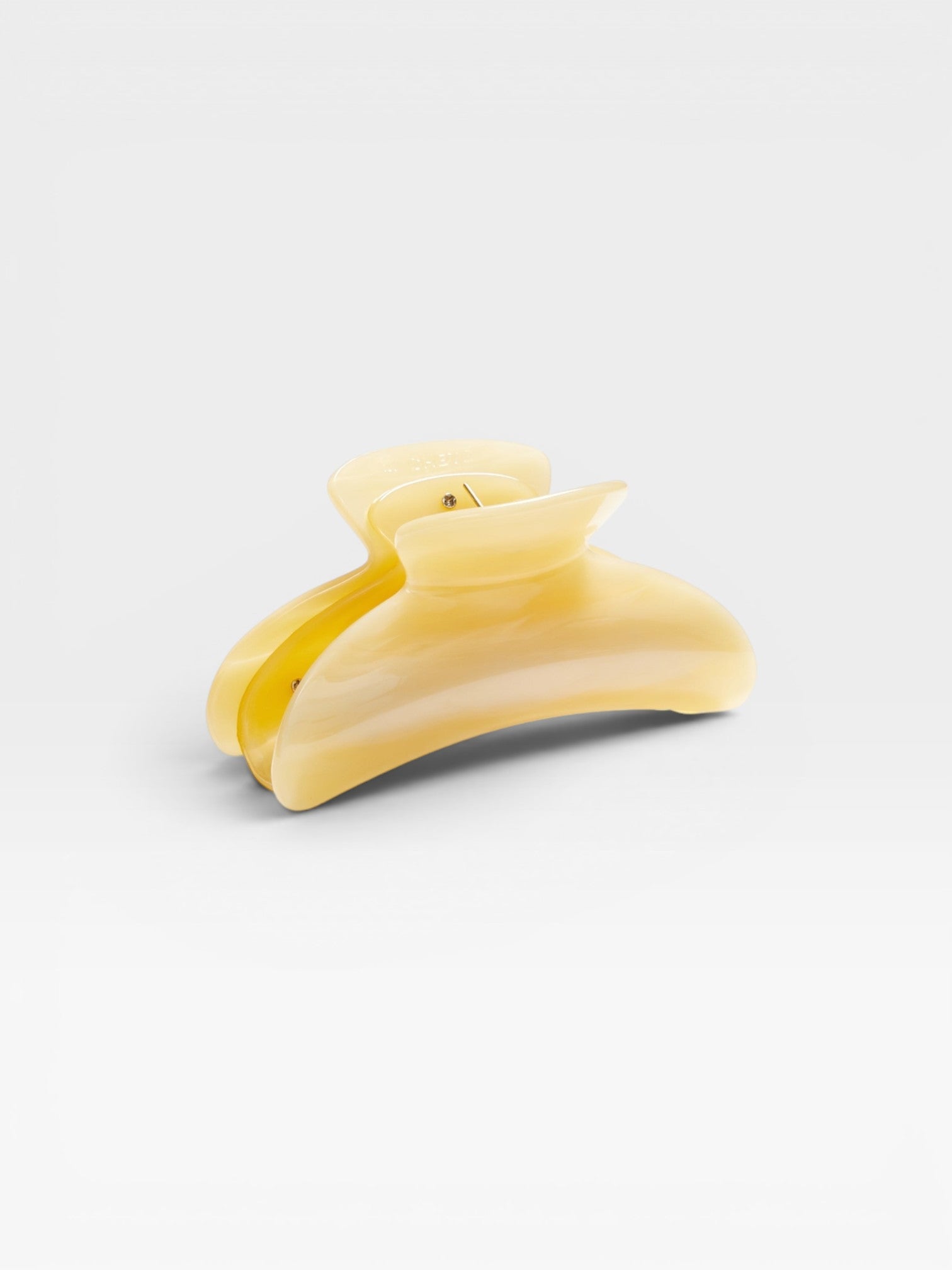 JONES + CO Grande Heirloom Claw Clip in pale yellow marbled acetate, perfect for thick hair updos.