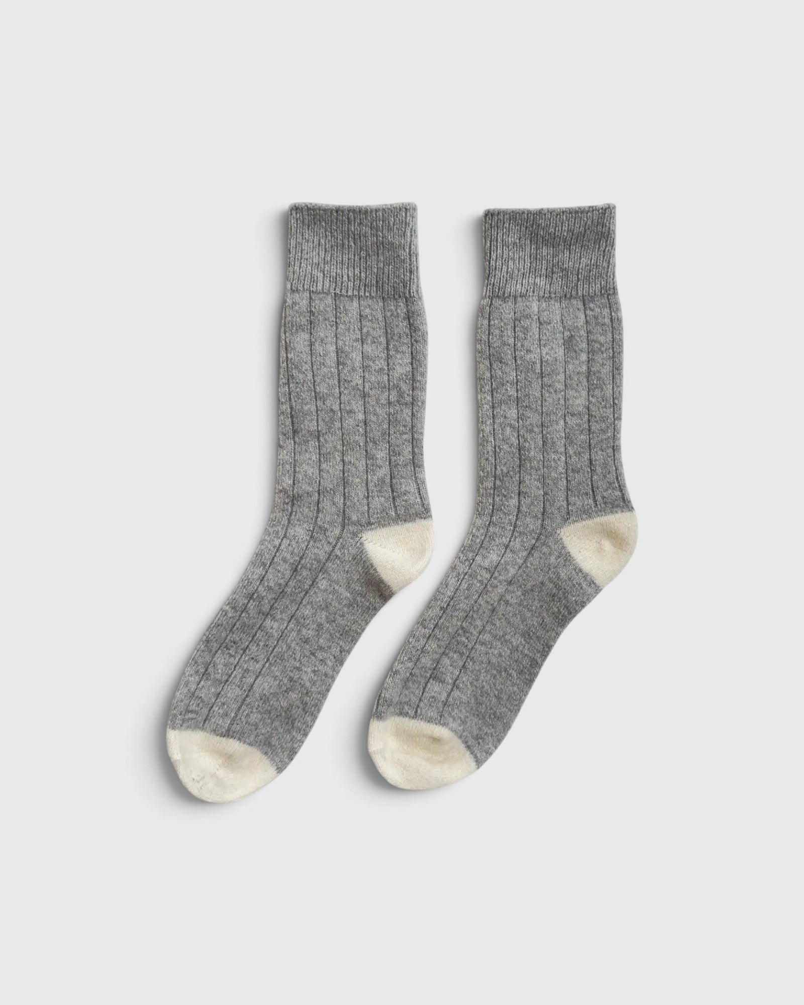 JONES + CO grey melange cashmere blend socks with wide ribbing and contrasting cream heel and toe details.