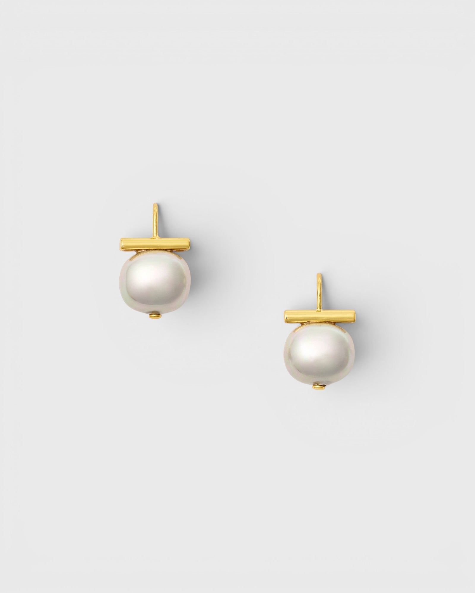 JONES + CO Cloud and gold Forever Fave pebble pearl earrings with a grey mother of pearl and 14k gold T-bar wire.