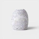 JONES + CO hand-drilled grey granite beach stone match striker with a smooth, natural river rock texture.