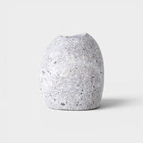 JONES + CO hand-drilled grey granite beach stone match striker with a smooth, natural river rock texture.