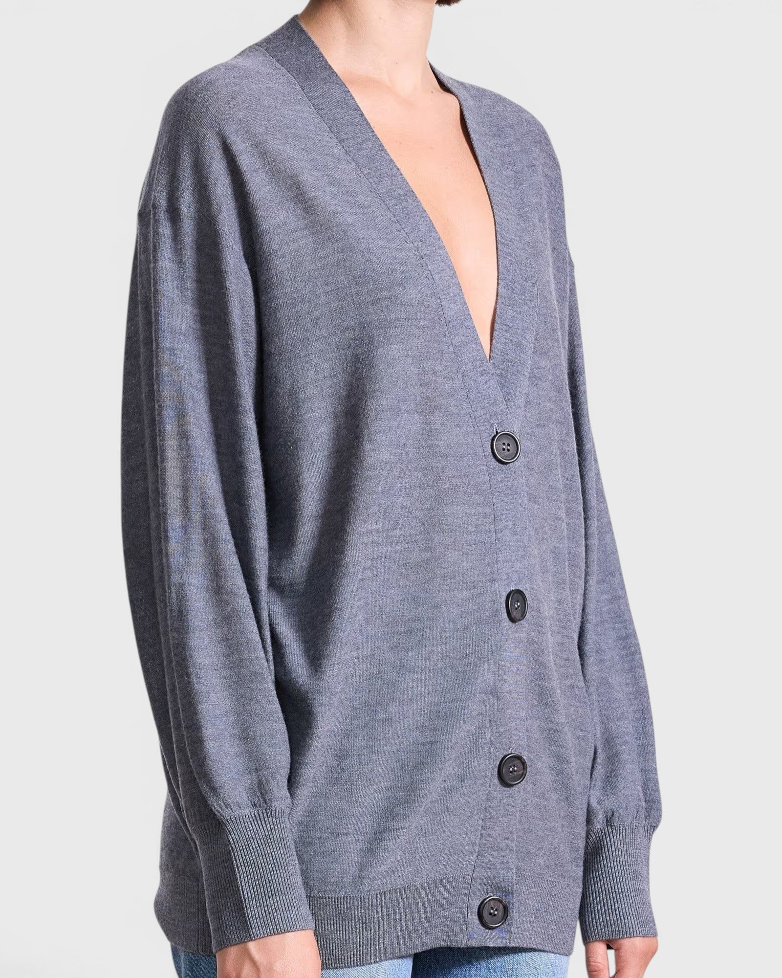 JONES + CO grey lightweight tissue cardigan with a deep V-neck and button-front closure worn by a model