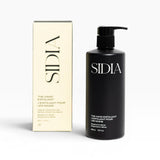 JONES + CO black matte bottle of The Hand Exfoliant with bergamot and vetiver scent, alongside its cream box.