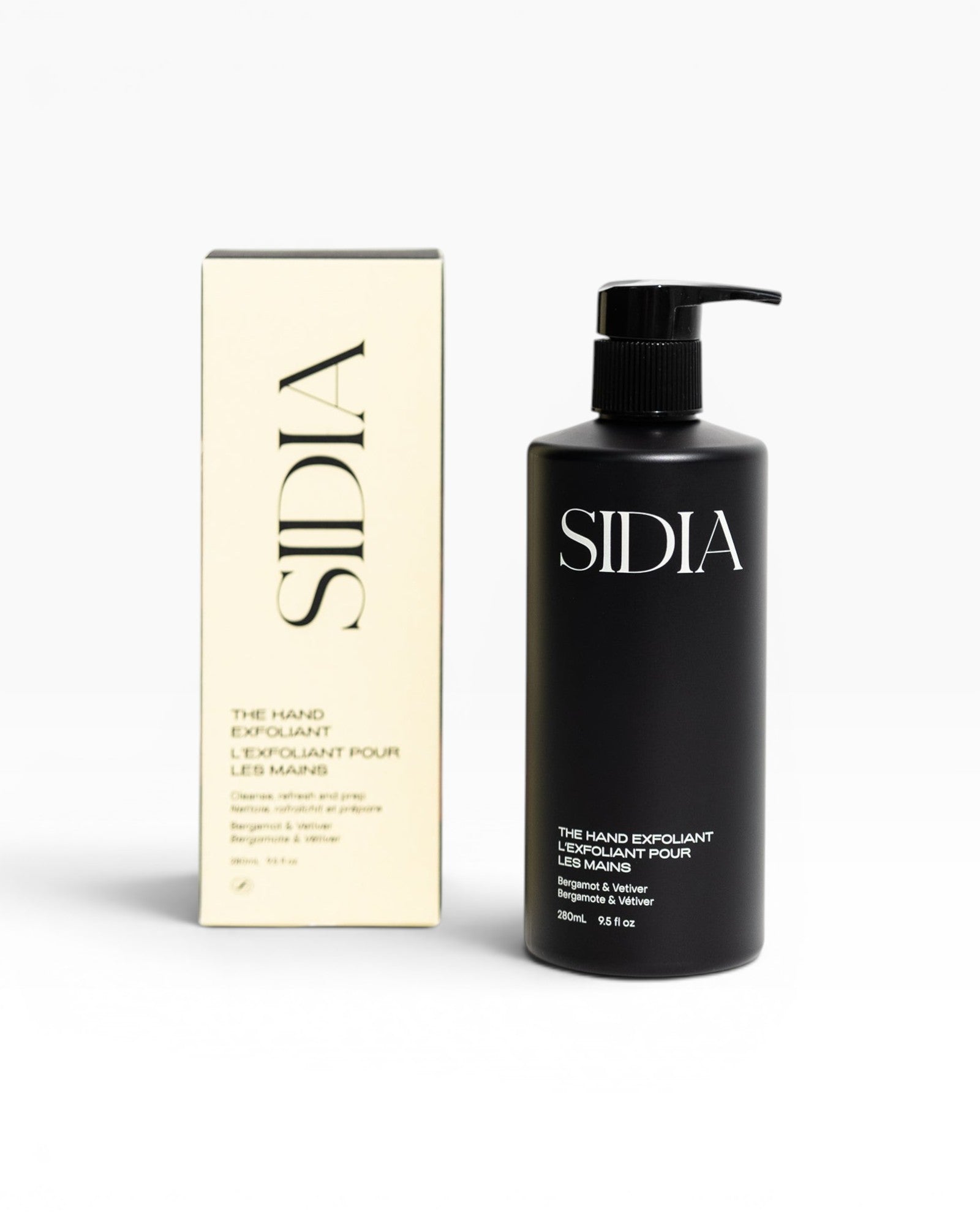 JONES + CO black matte bottle of The Hand Exfoliant with bergamot and vetiver scent, alongside its cream box.