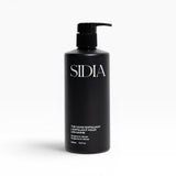 JONES + CO black matte bottle of The Hand Exfoliant with pump, featuring Bergamot & Vetiver scent.