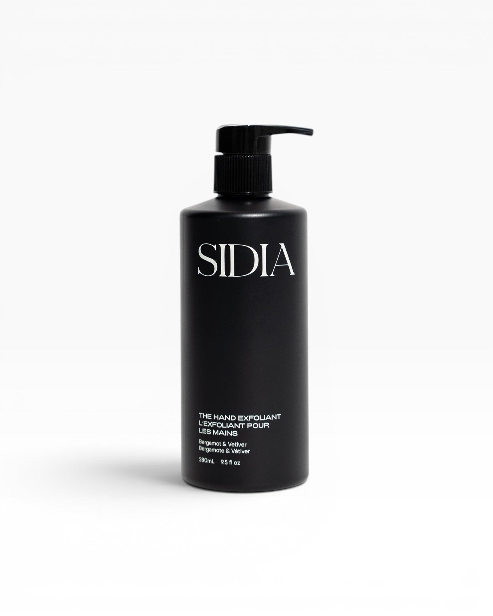 JONES + CO black matte bottle of The Hand Exfoliant with pump, featuring Bergamot & Vetiver scent.