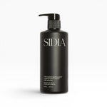 JONES + CO black matte bottle of The Hand Exfoliant with Bergamot & Vetiver scent, featuring a pump dispenser.