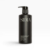 JONES + CO black matte bottle of The Hand Exfoliant with Bergamot & Vetiver scent, featuring a pump dispenser.
