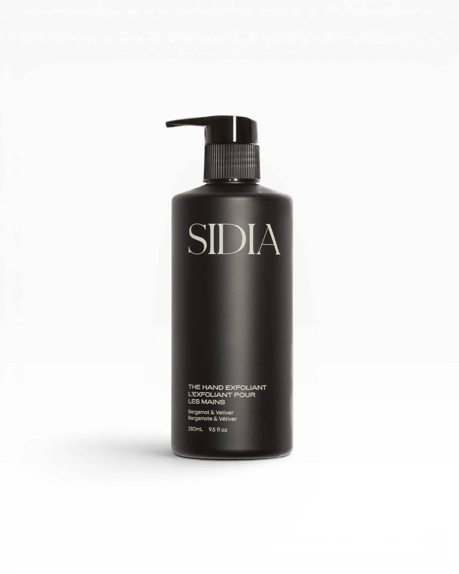 JONES + CO black matte bottle of The Hand Exfoliant with Bergamot & Vetiver scent, featuring a pump dispenser.