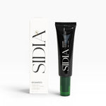 JONES + CO SOAKED Hand Serum in black tube with green cap, featuring Juniper, Cypress, and Musks scent.