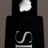 JONES + CO The Hand Serum in WIRED fragrance, a lightweight, fast-absorbing serum with a dollop on the pump.