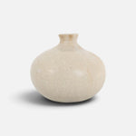 JONES + CO Vase No. 8, a handthrown beige ceramic vase with a speckled finish and rounded sculptural silhouette.