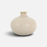 JONES + CO Vase No. 8, a handthrown beige ceramic vase with a speckled finish and rounded sculptural silhouette.