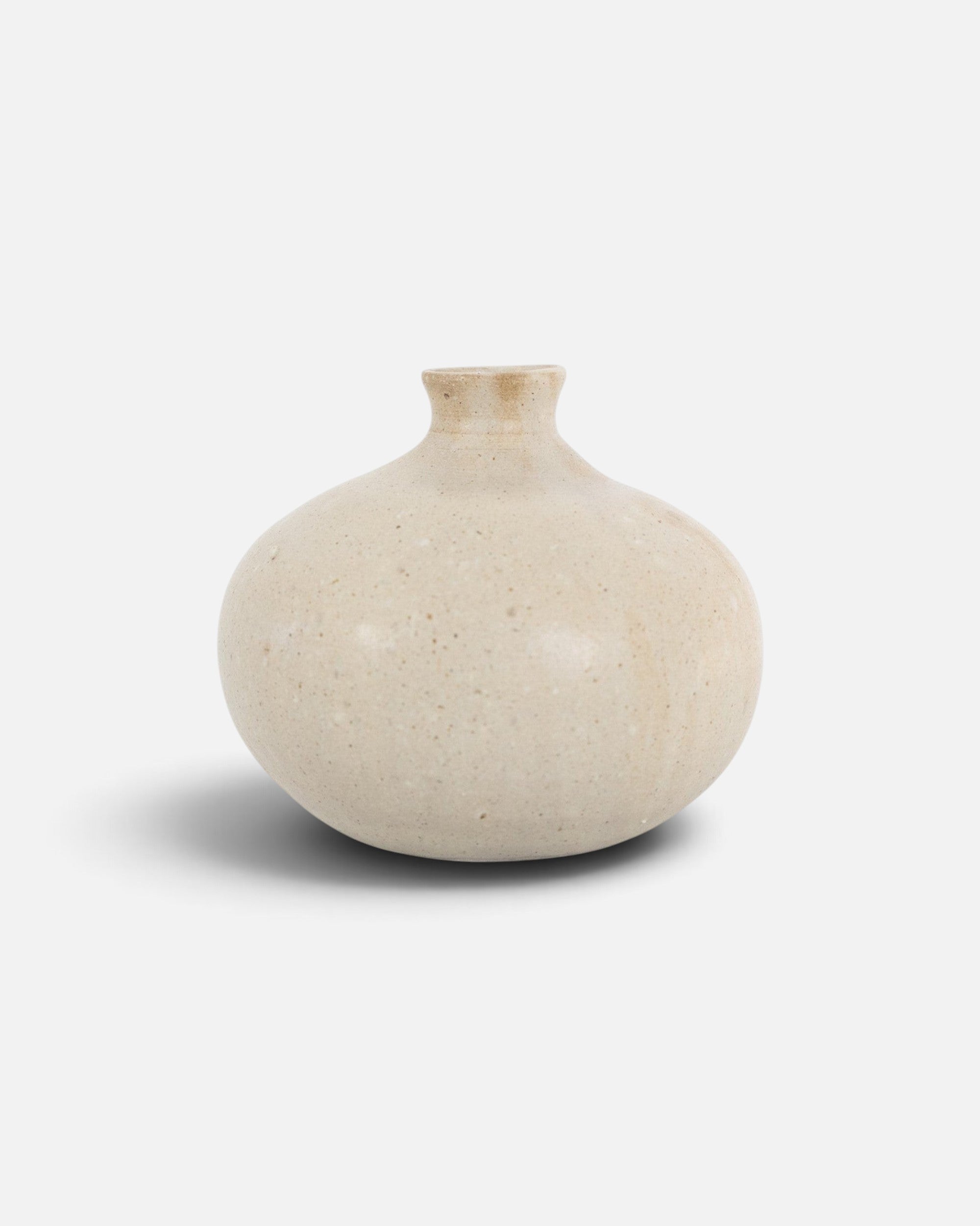 JONES + CO Vase No. 8, a handthrown beige ceramic vase with a speckled finish and rounded sculptural silhouette.