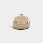 JONES + CO handthrown ceramic jar in a natural beige speckled finish with a small lid for storage.