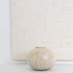 JONES + CO Vase No. 7, a handthrown ceramic vase with a speckled beige glaze and rounded sculptural shape.