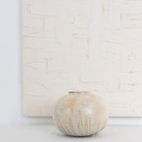 JONES + CO Vase No. 7, a handthrown ceramic vase with a speckled beige glaze and rounded sculptural shape.
